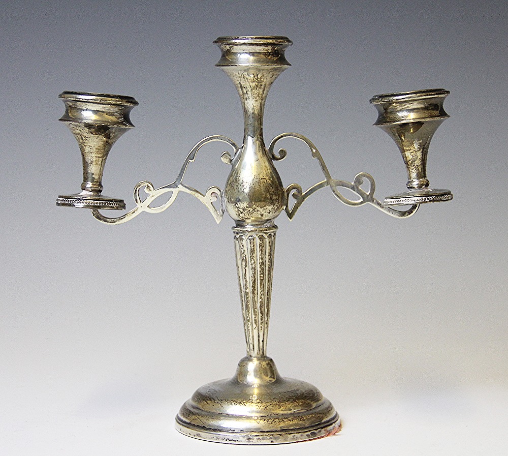 A silver candelabrum, E J Trevitt & Sons, Chester 1912, of baluster form and with two branches,