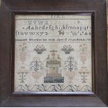 An early Victorian sampler, dated 1843, worked in cross stitch with alphabet sequences,