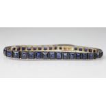 An Art Deco sapphire set graduated line bracelet,