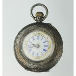 A silver cased lady's fob watch, the silver case with engine turned detail,