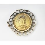 A Queen Victorian Jubilee head gold sovereign 1892, in foliate yellow metal mount,