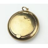 A 9ct gold miniature powder locket, Birmingham 1919, circular with heart shaped clasp,