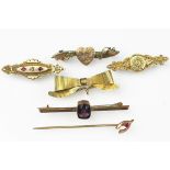 A selection of Victorian brooches, to include; two with locket back, a 9ct gold heart example,