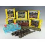 A collection of six Scenix model railway buildings, all boxed,