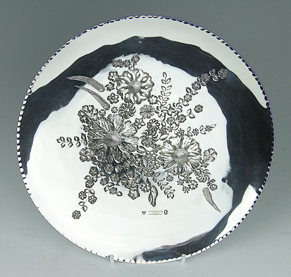 A silver dish, Birmingham 1977, 'SD' within sheild surround, of circular form,