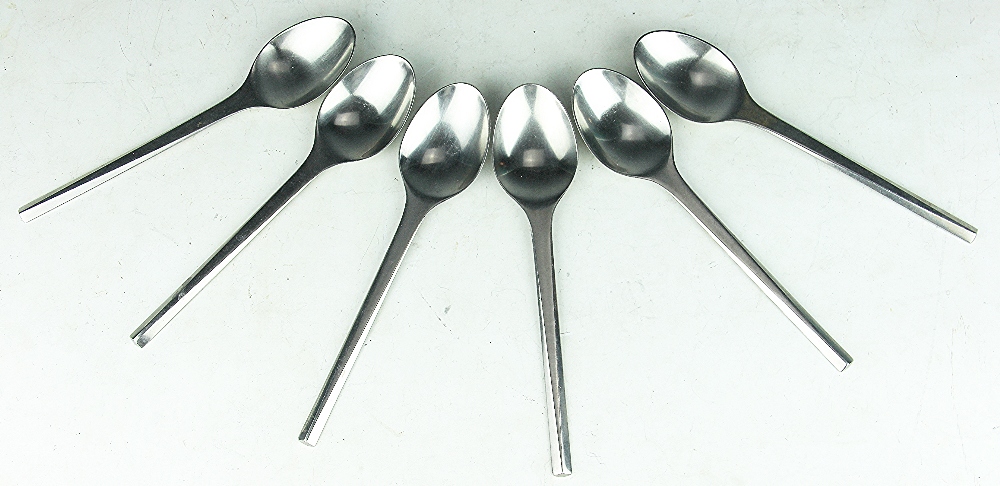 A set of Georg Jensen Danish stainless steel dessert spoons, stamped,