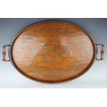 An Edwardian brass inlaid walnut oval tray, with turned handles and decorated with birds,