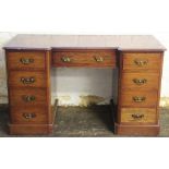 A late Victorian mahogany inverted pedestal desk,