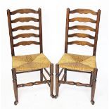 A set of six oak ladder back chairs, with rush seats,