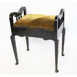 A Victorian stained pine piano stool, the hinged seat revealing storage on tapering legs, 62cm high,