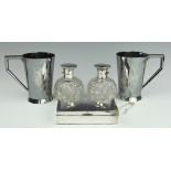 A pair of silver topped cut glass scent bottles and stoppers, Walker and Hall, Sheffield, 1922,