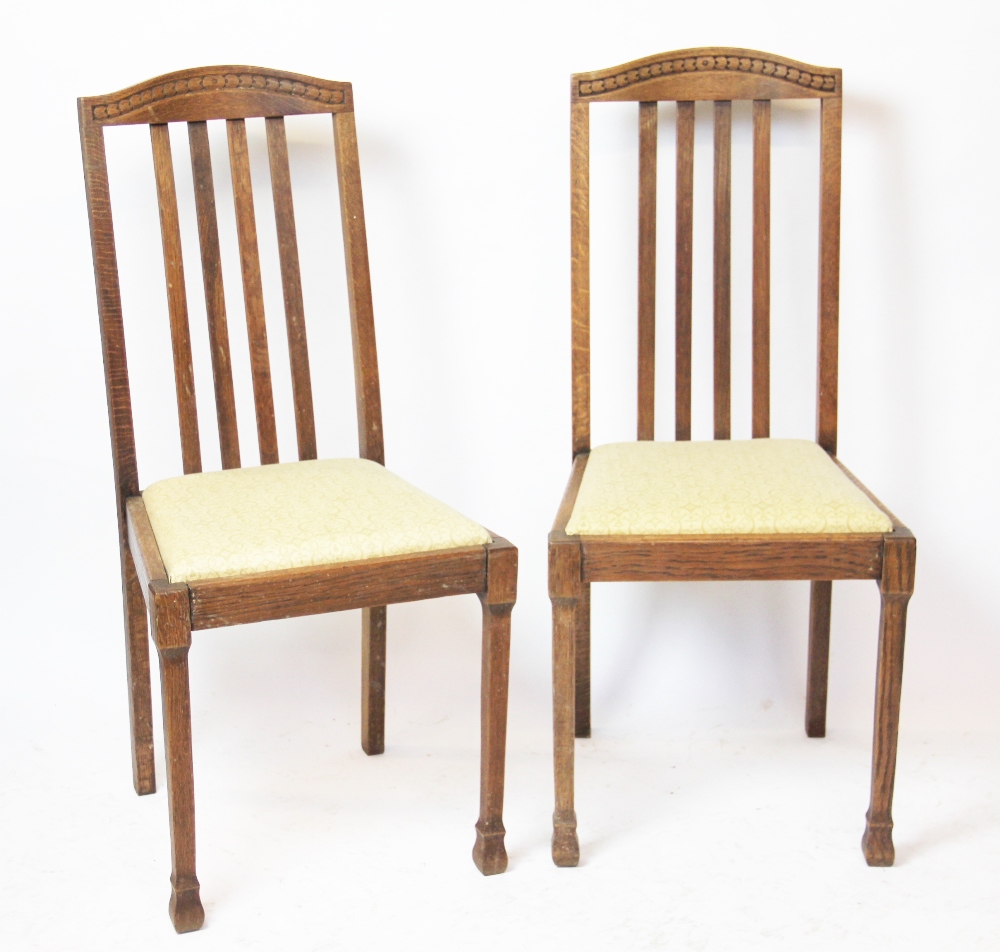 A set of four 1930's oak dining chairs,