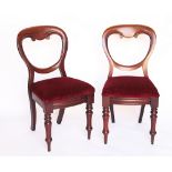 A set of four Victorian carved mahogany dining chairs,