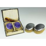 A cased pair of silver and lavender guilloche enamel brushes, Birmingham 1925,