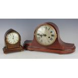 An Edwardian lancet shaped mantle clock, the oak and inlaid case with brass supports,