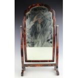 A 1920's Queen Anne style tortoiseshell toilet mirror, with bevelled plate,