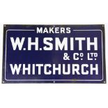 A 'W.H.Smith & Co Ltd Whitchurch' enamel advertising sign, against a blue ground, 35.