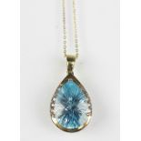 A blue topaz and diamond set pendant,