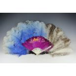 Two Ostrich feather fans in blue and grey with simulated tortoiseshell sticks and a further painted