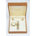A suite of 9ct Clogau Gold jewellery, comprising; a pendant and chain, ring and earrings,