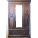 A late Victorian carved mahogany wardrobe, with blind fret detailing,