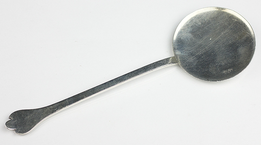 A silver spoon of dog nose type, S & Co, London 1916, of simple form with large, flat circular bowl,