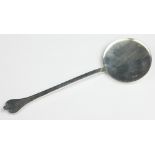 A silver spoon of dog nose type, S & Co, London 1916, of simple form with large, flat circular bowl,