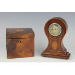 An Edwardian mahogany balloon shaped mantle clock,