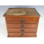 A Victorian collectors chest of four rectangular drawers, each with moulded handled,