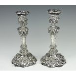 A pair of George IV silver candlesticks, 'T.