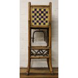 A Victorian bamboo jardiniere stand, inset with four majollica tiles, 81.