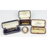 A collection of five assorted gold bar brooches, to include; stone set examples,