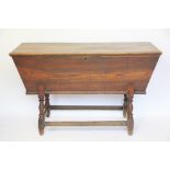 A 19th century dough bin, the hinged cover raised on canted body,