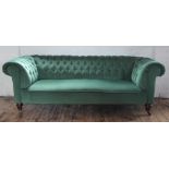 A Victorian button back Chesterfield settee, with green drailon upholstery,