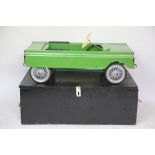 A Tri-ang childs pedal car, circa 1950's, with padded seat and adjustable steering wheel,