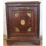 A late Victorian carved and brass inset oak purdonium,