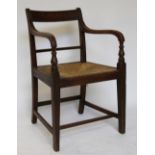 A George III mahogany carver dining chair, on ring turned legs,