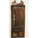 An 18th century style walnut fret frame pier mirror,