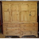A Victorian and later pine housekeepers cupboard, with moulded cornice and four panelled doors,
