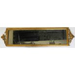 A 19th century giltwood and gesso rectangular wall mirror, 123cm x 31cm, with a smaller mirror,