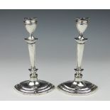 A pair of Edwardian silver candlesticks, Williams Ltd, Birmingham 1908, each of navette shape,