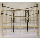 A late Victorian cast iron and brass double bed, with floral printed ceramic ball detailing,