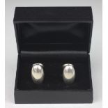 A pair of Boodle and Dunthorne silver cufflinks, each of sinuous form, 2.2cm long, total weight 30.