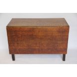 A George III oak drop leaf table, with drop leaf to one side only, square legs,