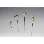 Four hatpins, to include; an enamelled example W&S,