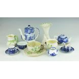 An assorted selection of Belleek, comprising a Cornucopia vase, a twin handled sugar bowl,