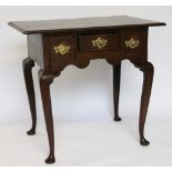 A George III and later oak low boy, the rectangular top with a moulded edge above three drawers,