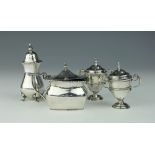 A selection of silver condiments, to include; a pair of Victorian trophy shaped pepperettes,