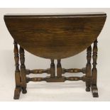 An oak gate leg table, 63cm H,