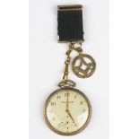 A Waltham pocket watch with Masonic fob,